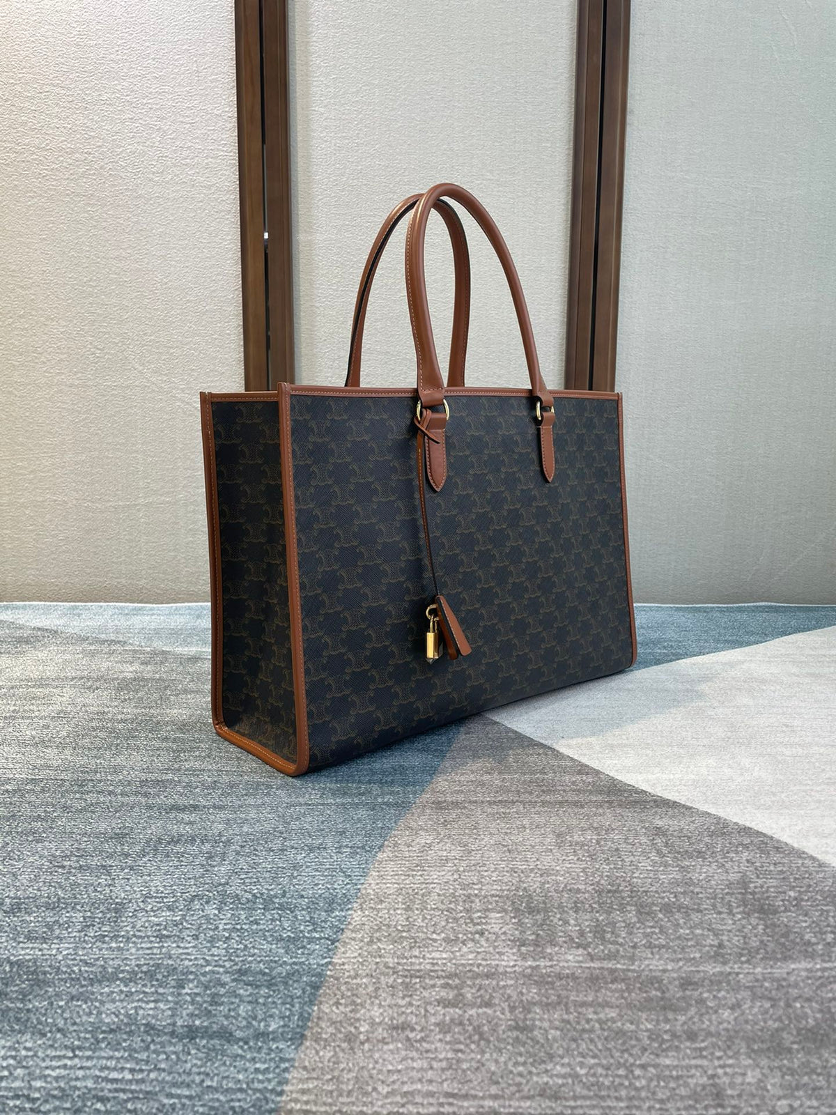 CELINE 25S HORIZONTAL CABAS 43MM IN BLACK TRIOMPHE CANVAS AND TAN BROWN CALFSKIN