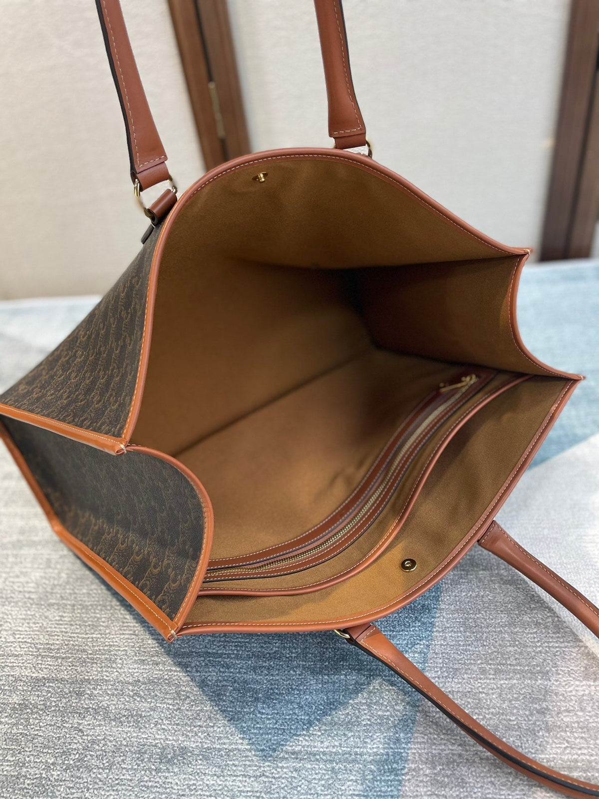 CELINE 25S HORIZONTAL CABAS 43MM IN BLACK TRIOMPHE CANVAS AND TAN BROWN CALFSKIN