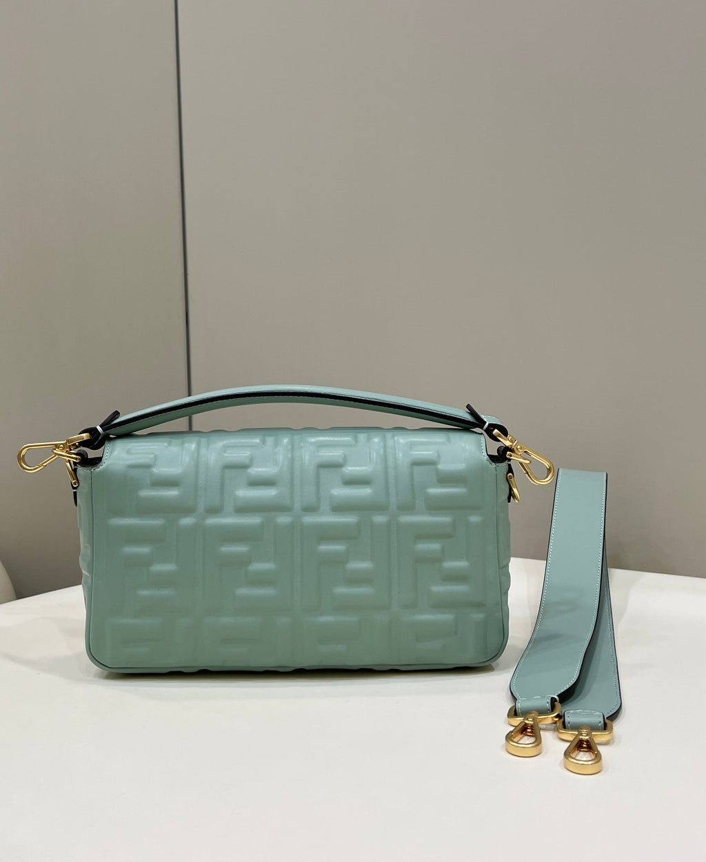 BAGUETTE WITH FF MOTIF 27 IN VIRIDIAN GREEN SOFT LAMBSKIN GOLD HARDWARE