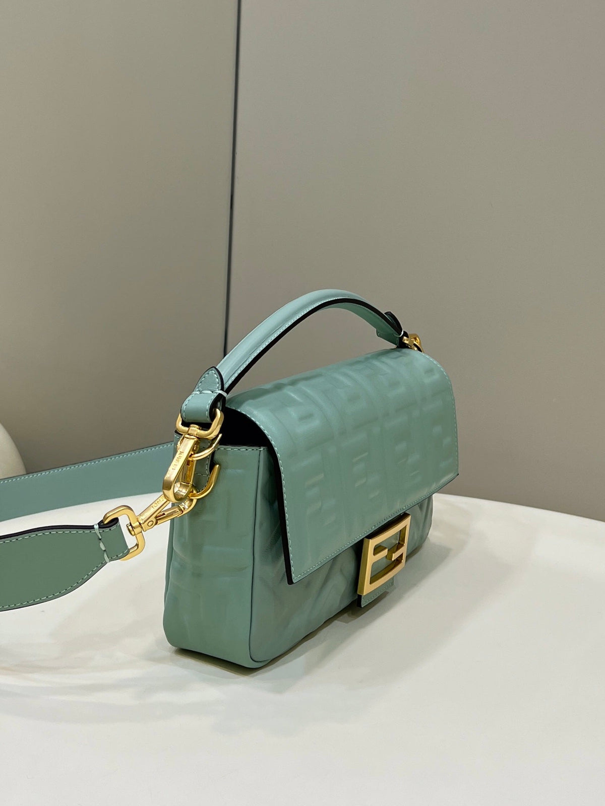 BAGUETTE WITH FF MOTIF 27 IN VIRIDIAN GREEN SOFT LAMBSKIN GOLD HARDWARE