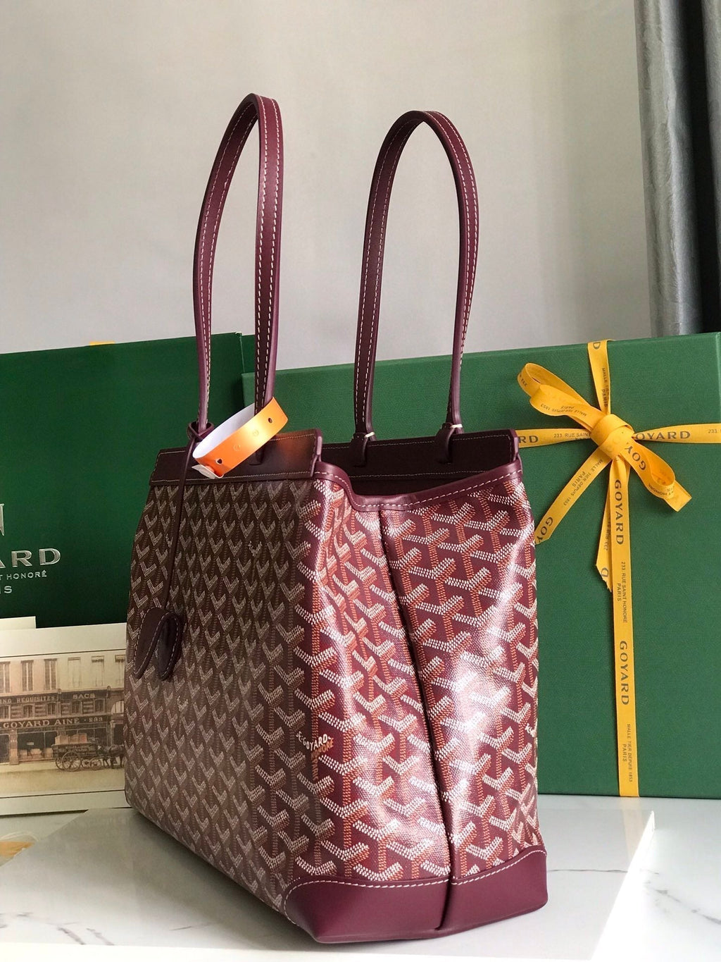 BELLECHASSE BIAUDE PM BAG 36 IN WINE RED GOYARDINE CANVAS AND CALFSKIN TRIM