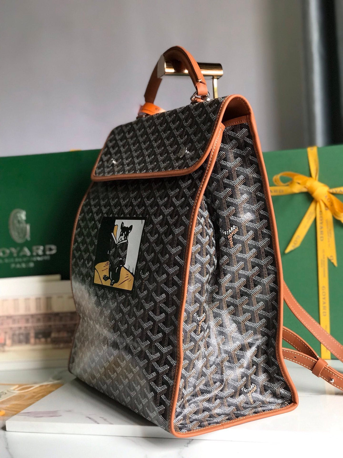 SAINT LÉGER BACKPACK 35 IN BROWN GOYARDINE CANVAS AND CALFSKIN WITH CARTOON PATCH