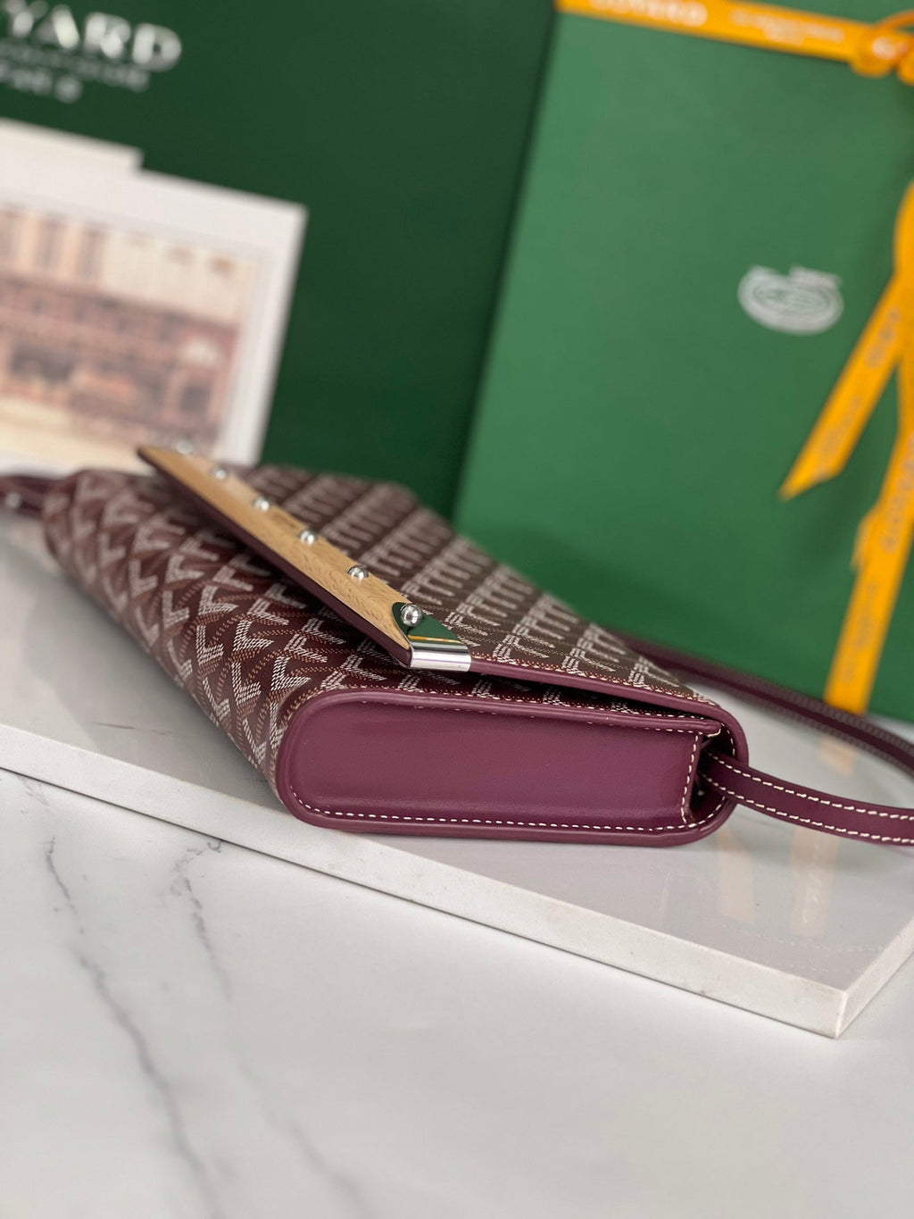 MONTE-CARLO PM CLUTCH 25 IN WINE RED GOYARDINE CANVAS