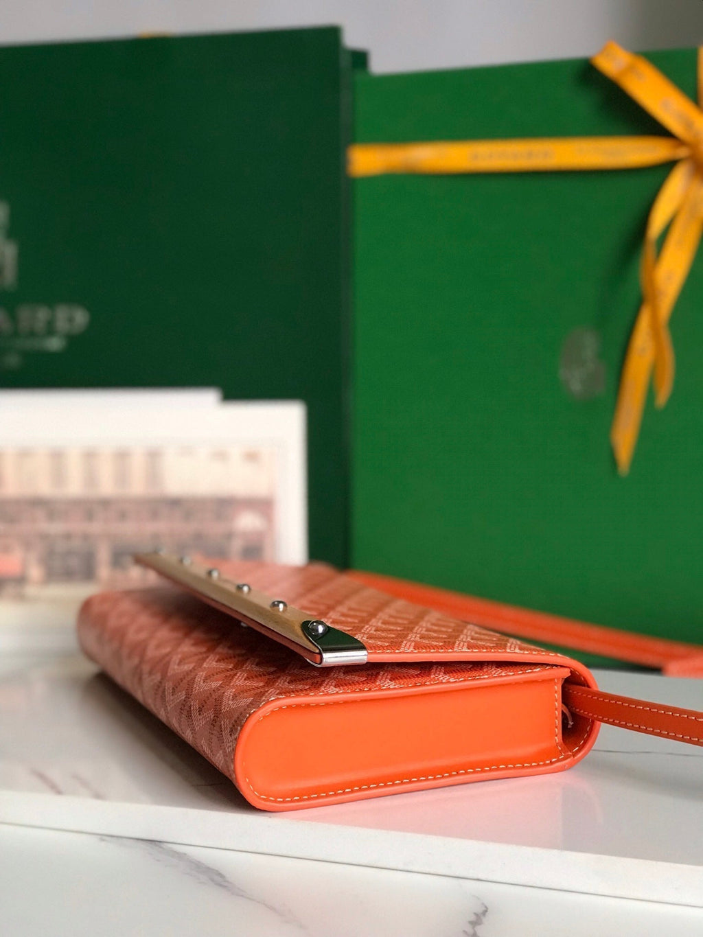 MONTE-CARLO PM CLUTCH 25 IN ORANGE GOYARDINE CANVAS