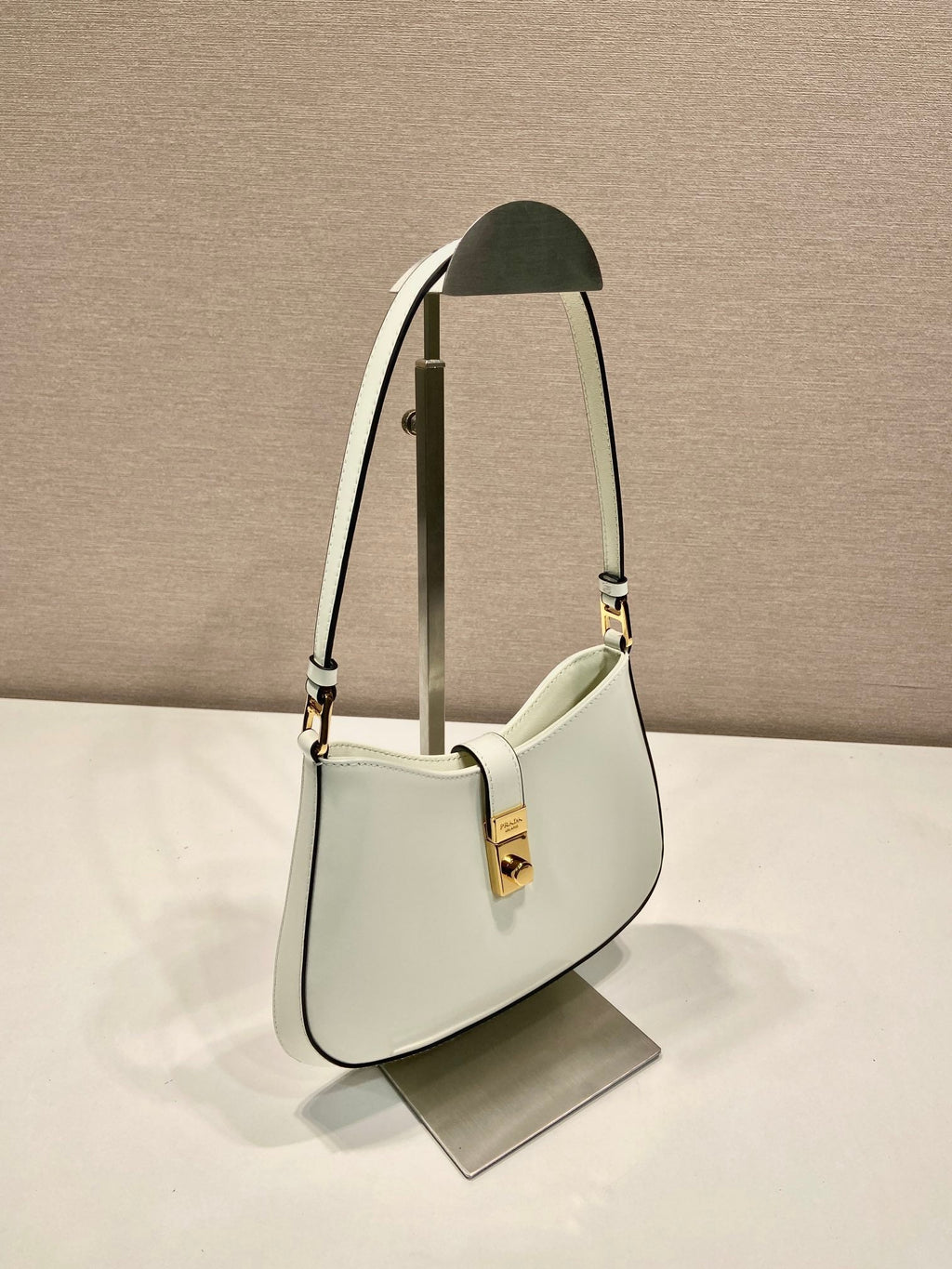 PRADA CLEO SHOULDER BAG 22 IN WHITE BRUSHED LAMBSKIN WITH CLASP CLOSURE