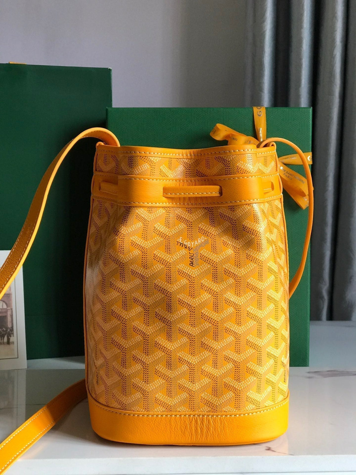 PETIT FLOT BUCKET BAG 22 IN YELLOW GOYARDINE CANVAS AND LAMBSKIN TRIM