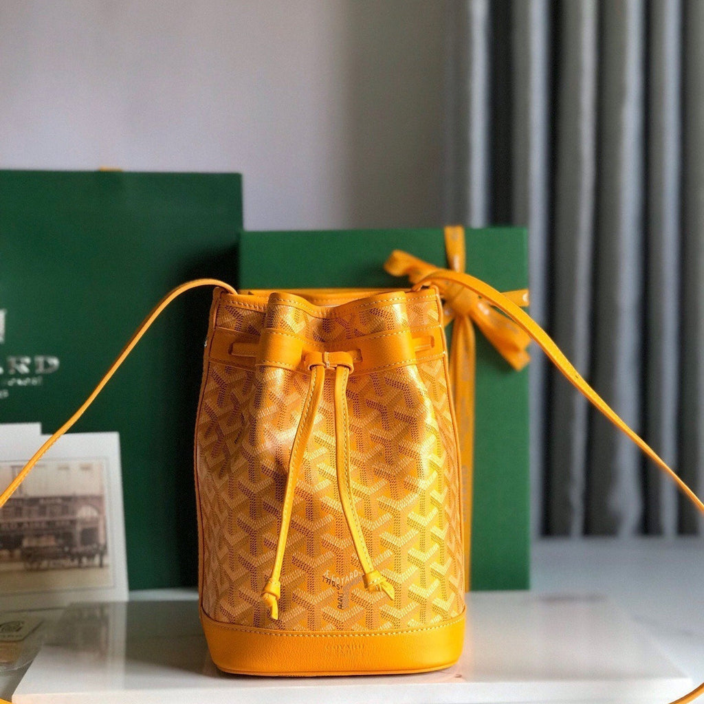 PETIT FLOT BUCKET BAG 22 IN YELLOW GOYARDINE CANVAS AND LAMBSKIN TRIM
