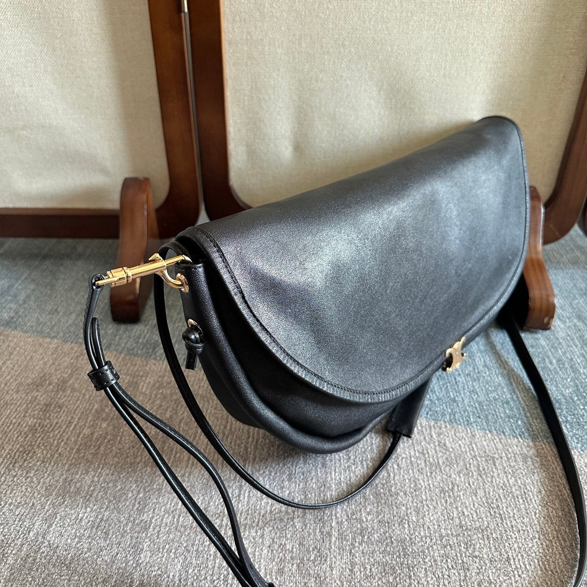 CELINE 25S HALFMOON SOFT TRIOMPHE BAG 46MM IN BLACK SUPPLE SHINY LAMBSKIN
